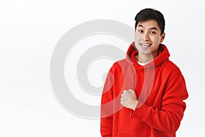 Waist-up portrait upbeat, enthusiastic young man cheering up team, fist pump encourage people live-up smile and be happy