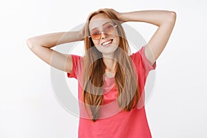 Waist-up shot of carefree relaxed and happy young redhead woman enjoying life spending summer holidays in warm sunny