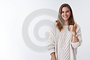 Waist-up supportive attractive happy woman cheering expressing support like product, showing thumb up smiling