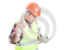 Wait a minute concept with constructor holding tablet