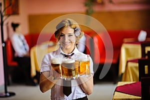 waiter with beer in the hands