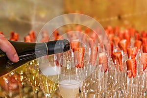 Waiter with a bottle of champagne