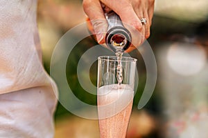 Waiter with a bottle of champagne