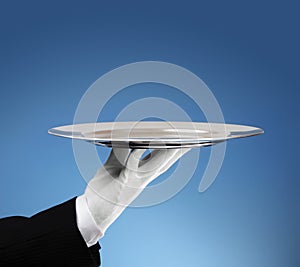 Waiter with empty silver tray photo