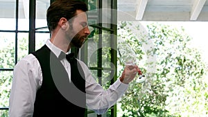 Waiter examining a empty wine glass