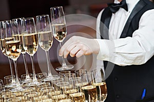 Waiter with glass of champagne