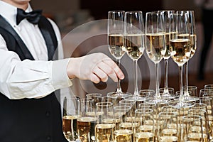 Waiter with glass of champagne