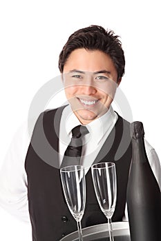 Waiter in his 20s serving champagne