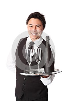 Waiter in his 20s serving champagne