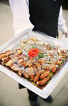 Waiter holding appetizer tray