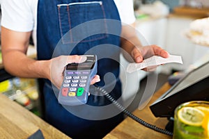 Waiter holding credit card reader