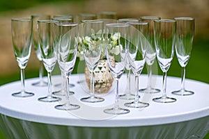 Waiter holding a lot champagne glasses