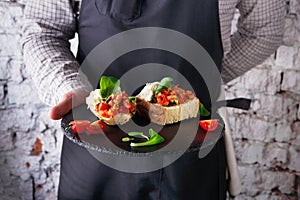 Waiter offering delicious restaurant dish photo