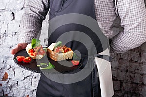 Waiter offering delicious restaurant dish photo