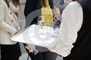 waiter offering wine at party