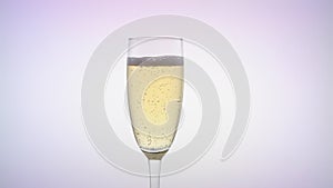 Waiter pours the champagne into the glass. White background