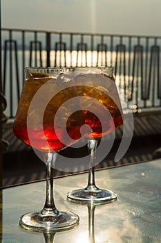 Waiter prepared the Aperol Sprits summer cocktail with Aperol, p