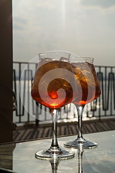 Waiter prepared the Aperol Sprits summer cocktail with Aperol, p