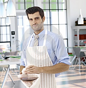 Waiter preparing red wine in restaurant