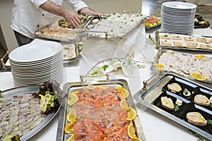 Waiter preparing wedding buffet