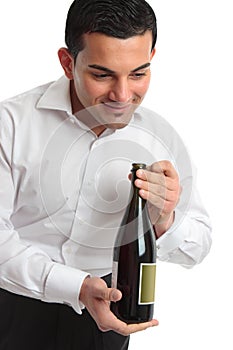 Waiter presenting bottle of wine