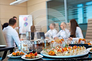 Waiter serving a banquet in the office