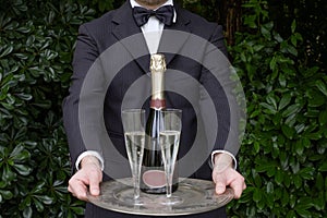 Waiter serving champagne
