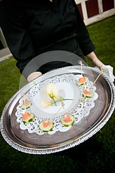 Waiter serving food during an event