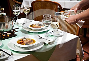 Waiter Serving Food at Restaurant