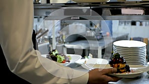 Waiter serving in motion on duty in restaurant