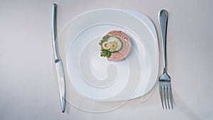 Waiter serving a plate of delicacy