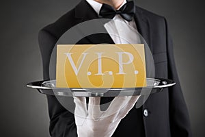 Waiter Showing Vip Text On Banner