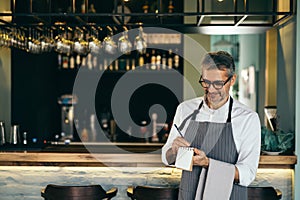 Waiter taking order from customers