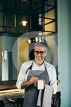 Waiter taking order from customers