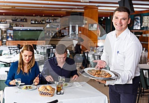 Waiter with tray of crustaceans