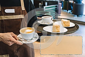 Waiter with a tray in one hand, glass of coffee, and two servings of cake