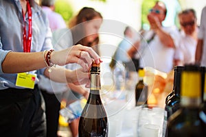 Waiter uncorked bottle of wine