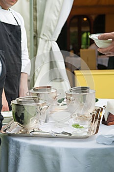 Waiters serve ice cream during a party