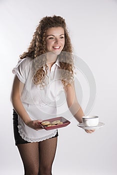 Waiters serving tea and biscuits