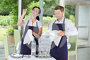 Waiters setting wedding table at restaurant photo