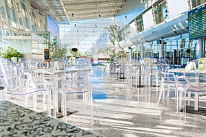 The waiting hall at the airport terminal with cafe