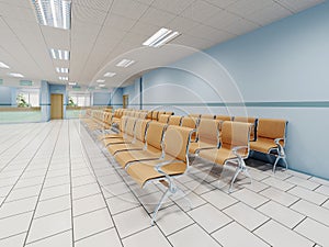 A waiting room in the clinic with orange chairs and light blue walls and white floors