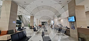 Waiting room in empty reception and registration area in hospital with modern minimalist interior design.