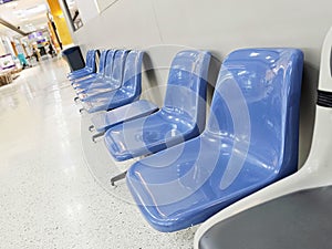 Waiting room in medical office interior with chairs.