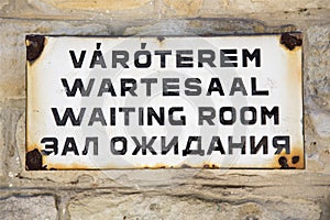 Waiting room sign, words on four languages photo