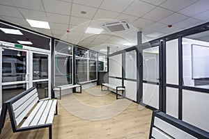 waiting room with wooden benches at a train station