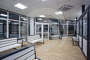 waiting room with wooden benches at a train station