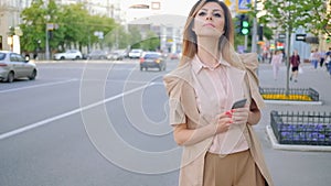 Waiting taxi anticipated worried woman check phone