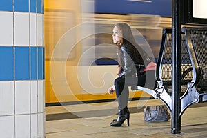 Waiting woman at train station photo