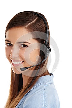 Waiting for your call. Studio shot of a beautiful young customer service agent wearing a headset against a white